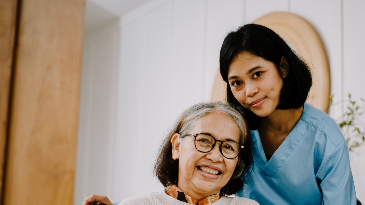 A Caregiver giving care to an old woman